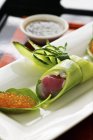 Cucumber rolls with tuna fish and char caviar with a wasabi dip — Stock Photo