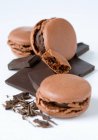 Chocolate macaroons on white background — Stock Photo