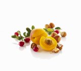 Apricots with cranberries and hazelnuts — Stock Photo