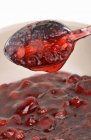 Cranberry jelly in spoon — Stock Photo
