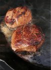 Fillet steaks in pan — Stock Photo