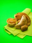 Elevated view of assorted pies and pastries on paper towel — Stock Photo