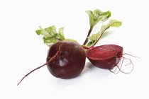 Whole and halved fresh Beetroot — Stock Photo