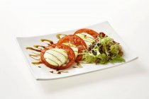 Tomatoes and mozzarella  cheese — Stock Photo
