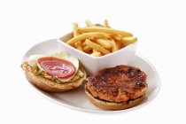 Salmon burger with potato fries — Stock Photo