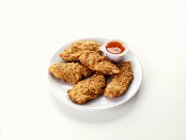 Chicken goujons with dip — Stock Photo