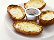 Baked potatoes with cheese — Stock Photo