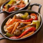 Roasted Vegetables in Cast Iron Skillet  on wooden surface — Stock Photo