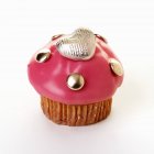 Muffin with pink icing — Stock Photo