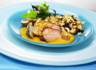 Duck breast with mushrooms and rice — Stock Photo