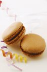 Brown macarons with ribbons — Stock Photo