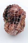 Closeup view of cooked octopus in net — Stock Photo