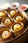 Closeup view of Chinese steamed buns in bamboo steamers — Stock Photo