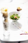 Elevated view of fresh vegetable seedlings and nut salad — Stock Photo