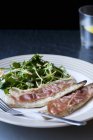 Mackerel with bacon and salad — Stock Photo