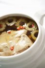 Closeup view of duck soup in white dish — Stock Photo