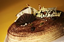 Birthday cake with sign — Stock Photo