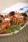 Closeup view of stuffed crabs with herbs — Stock Photo