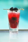 Closeup view of iced cocktail with blackberries — Stock Photo