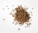 Closeup top view of Caraway seeds on white background — Stock Photo