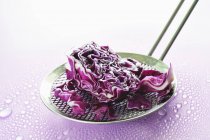 Red cabbage on skimmer — Stock Photo