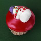Cupcake with snowman decoration — Stock Photo