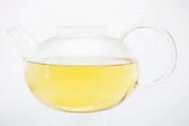 Tea in glass teapot — Stock Photo