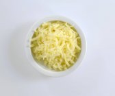 Dish of grated cheese — Stock Photo