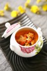 Closeup view of crab soup in painted pot — Stock Photo