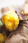 Roasted sweet potatoes on blurred background — Stock Photo