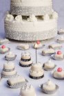 Wedding cake and small fours — Stock Photo