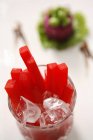 Closeup view of red Guatiao sticks and ice cubes — Stock Photo