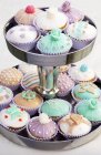 Cupcakes on tiered stand — Stock Photo