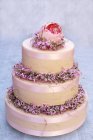Three-tiered cream cake — Stock Photo