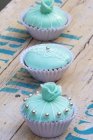 Three turquoise cupcakes — Stock Photo
