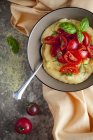 Top view of Polenta with fresh tomatoes and basil — Stock Photo
