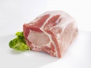 Raw Loin of pork with lettuce — Stock Photo