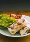 Closeup view of chicken wraps with vegetable salad — Stock Photo