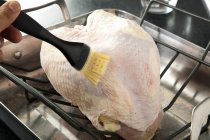 Brushing Butter on Turkey Breast — Stock Photo