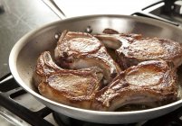Pork Chops Browning in Skillet — Stock Photo