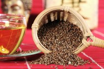 Perilla seed tea in tea strainer — Stock Photo