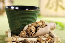 Saposhnikovia root in tea strainer — Stock Photo