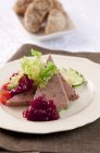 Closeup view of Ardennes pate with lingonberry jam and salad — Stock Photo