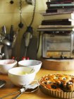 Dried plum tart in a kitchen interior — Stock Photo