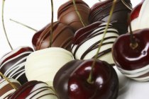 Chocolate-coated cherries — Stock Photo