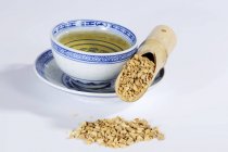 Tea and dried water plantain root — Stock Photo