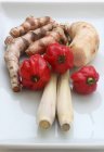 Turmeric roots with galangal and chilli Peppers — Stock Photo