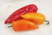 Red and orange pointed peppers — Stock Photo