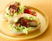 Sausage sandwich with sauce — Stock Photo