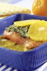 Baked orange salmon with spinach — Stock Photo